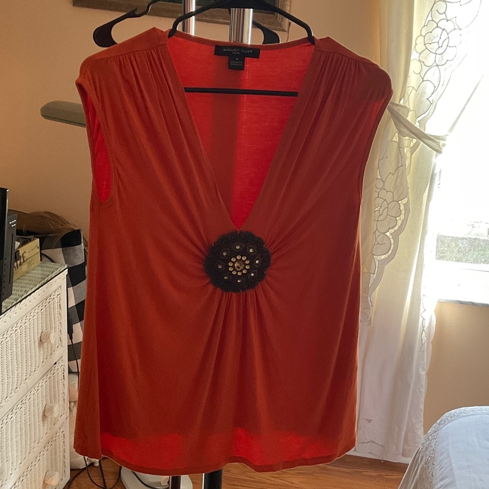 Ann Taylor Deep Orange Sleeveless Blouse with Floral Accent